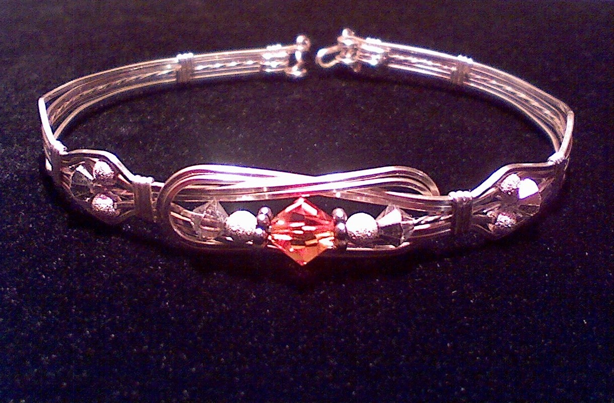 Reef Knot Bracelet in Sterling Silver and Fire Opal Swarovski Crystal